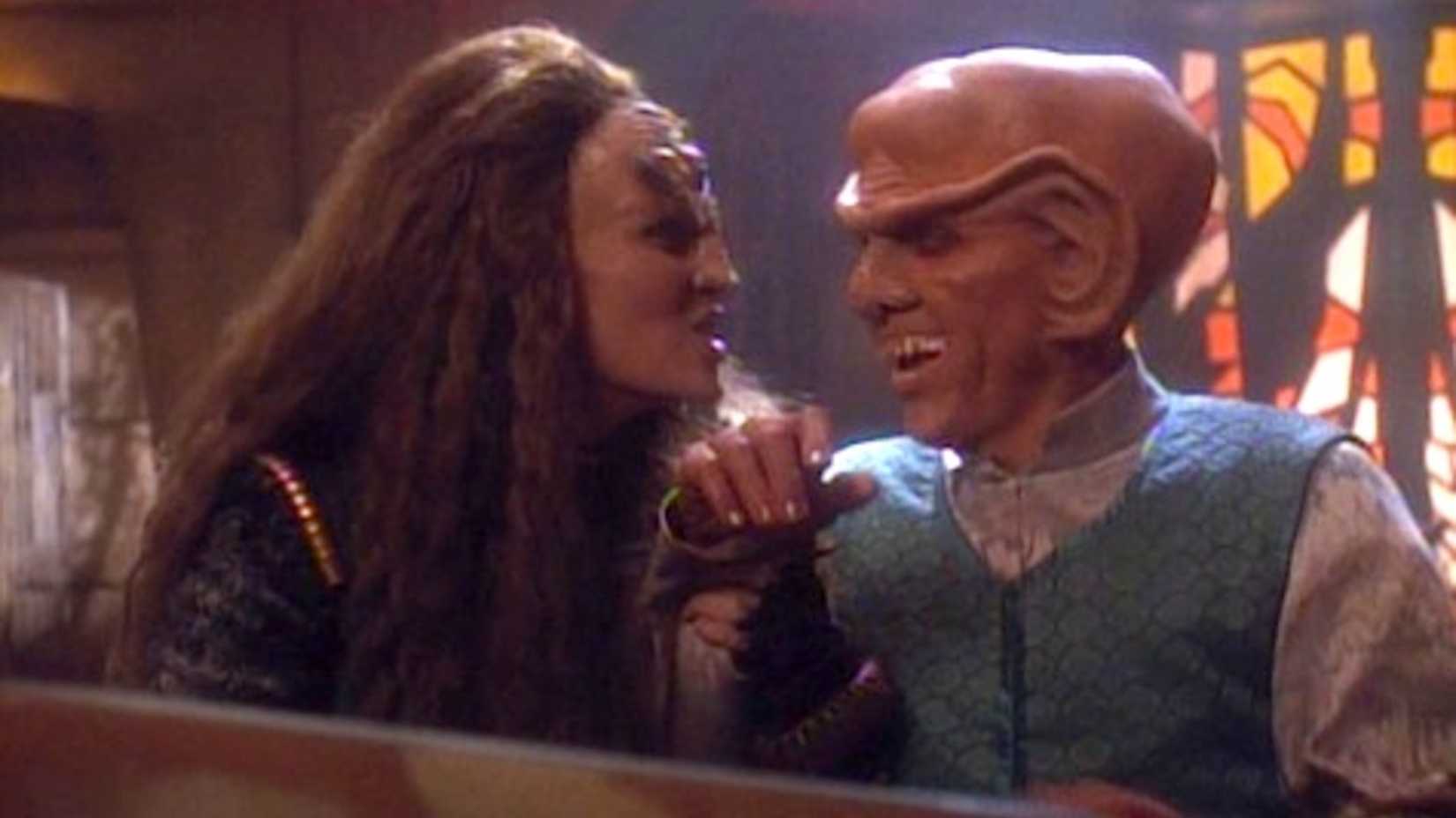 Quark and his Klingon bride laugh in the Deep Space Nine episode "The House of Quark"