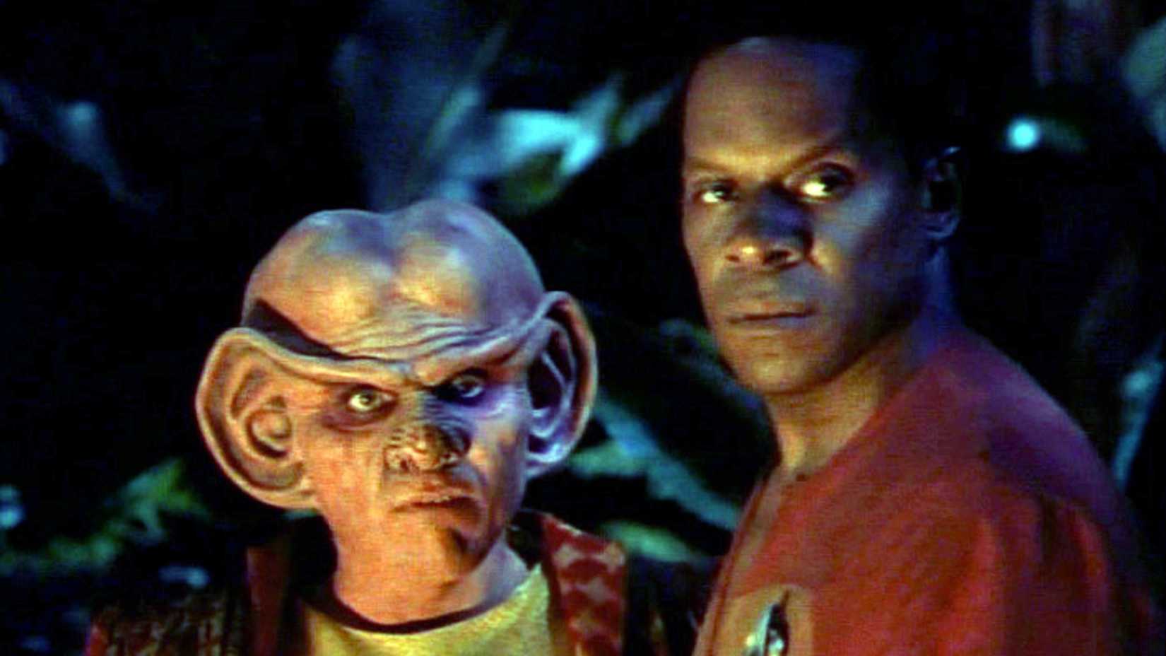 Quark and Sisko look on in the Deep Space Nine episode "The Jem'Hadar"