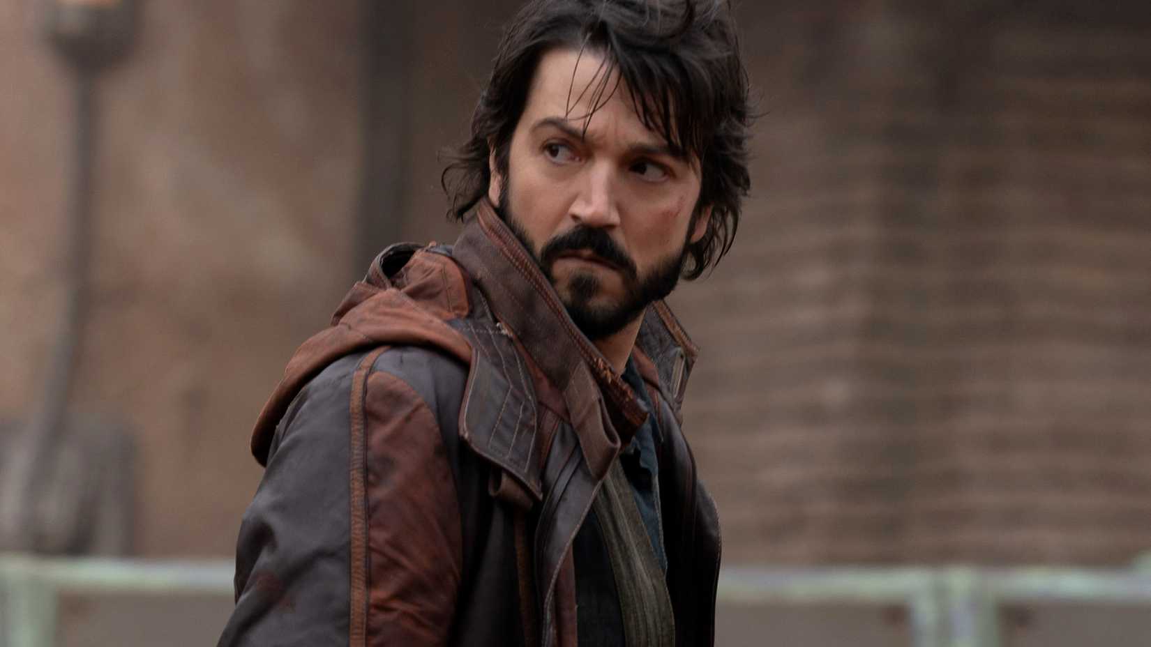 Diego Luna as Cassian Andor looking over his shoulder in Andor season 1