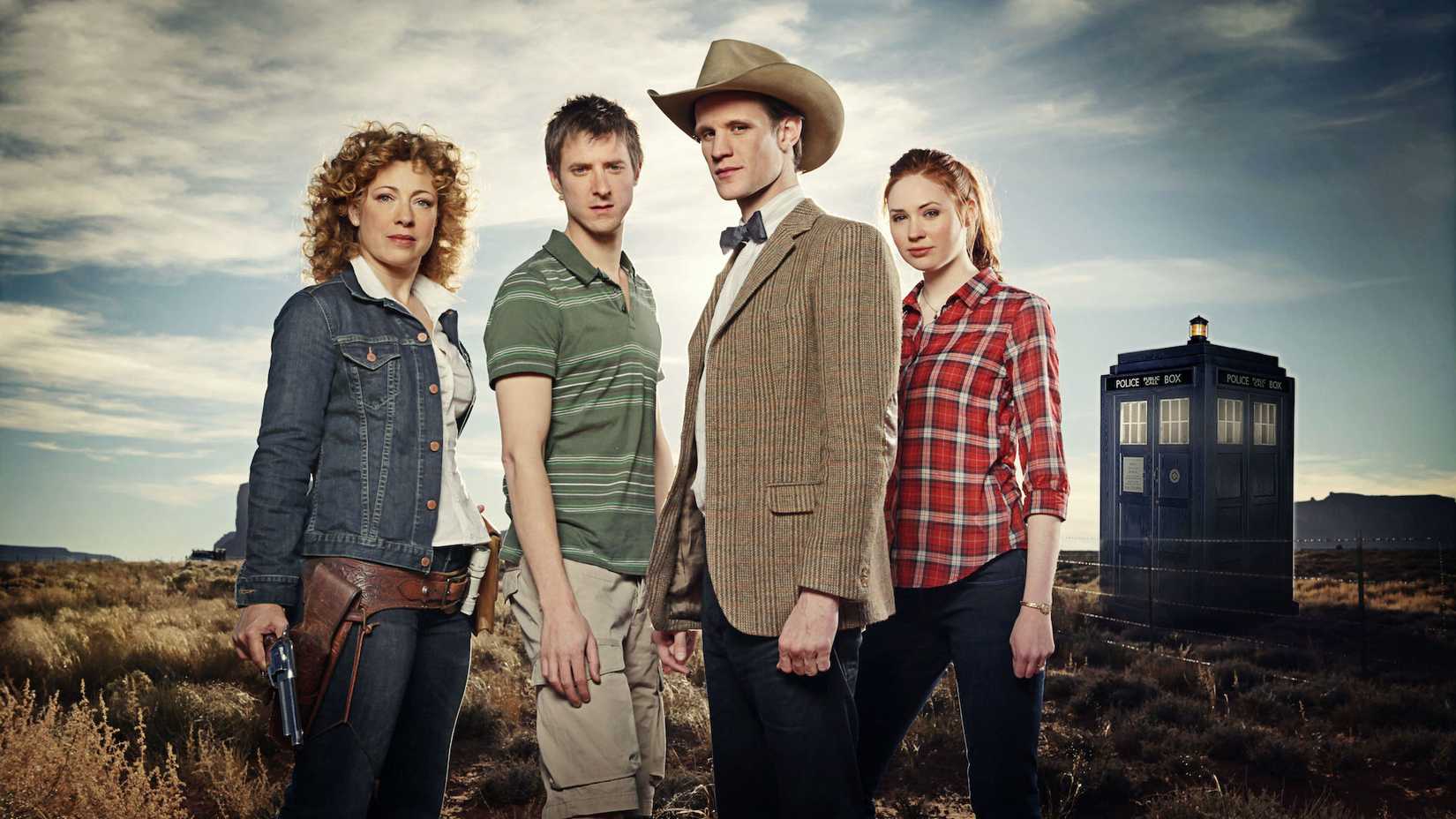 The Eleventh Doctor, River Song, Rory Williams, and Amy Pond standing out in a desert near the TARDIS
