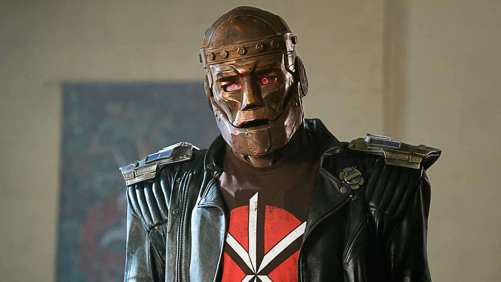 Robotman wearing a black leather jacket and graphic t-shirt