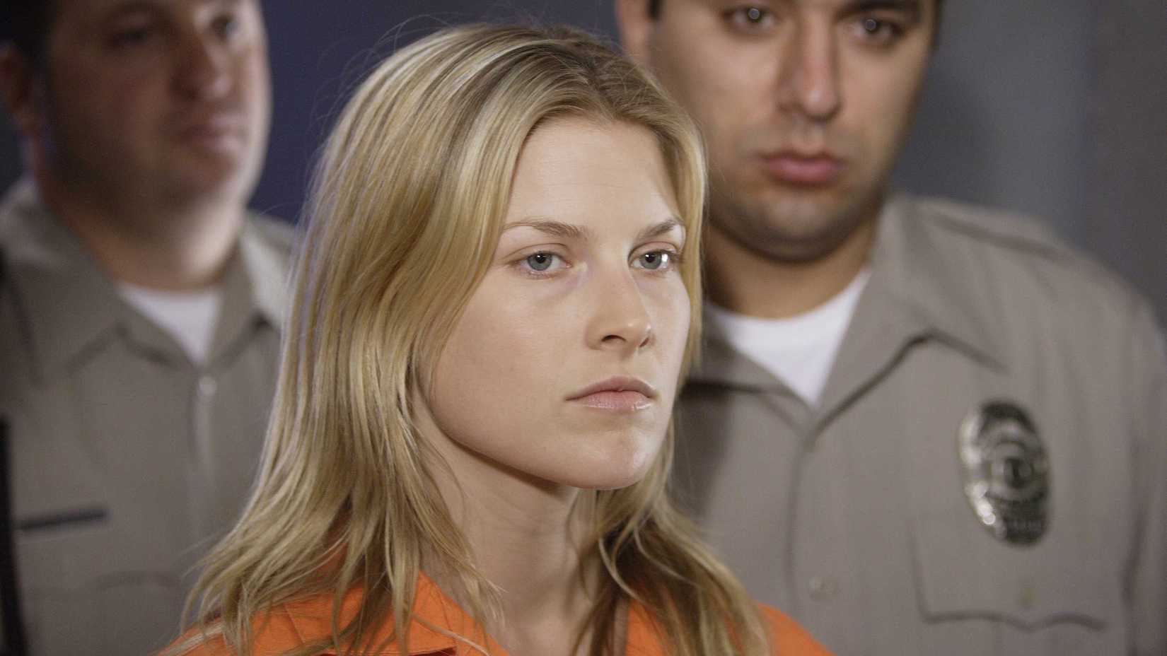 Heroes still featuring Ali Larter as Tracy Strauss, wearing an orange jumpsuit and frowning.