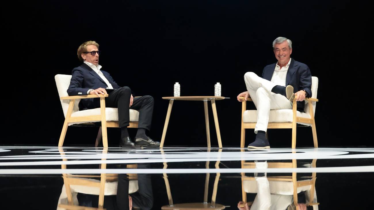 Jerry Bruckheimer and Eddy Cue seated on stage for their Cannes Lions Fireside Chat