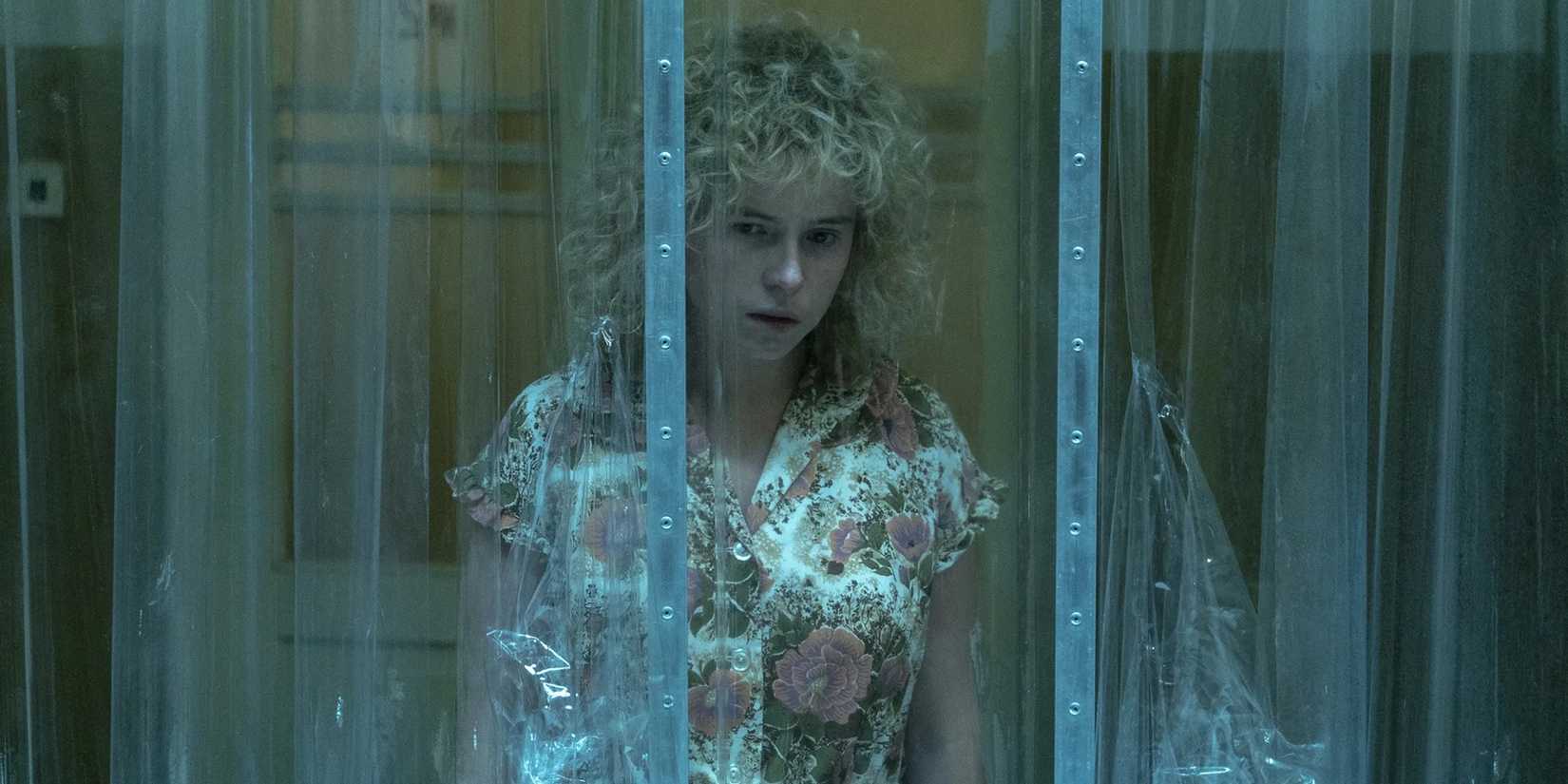 Jessie Buckley in a hospital looking shocked in Chernobyl