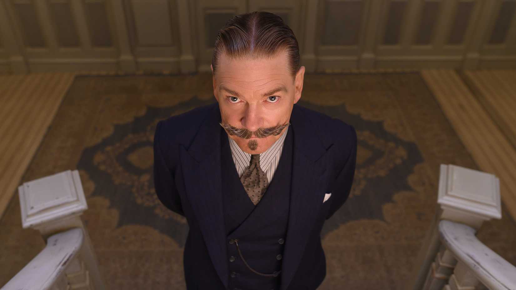 Kenneth Branagh as Hercule Poirot, looking upwards, in a still from Death on the Nile