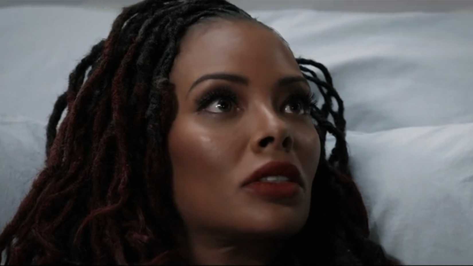 Madam in a hospital bed with her hair down in All the Queen's Men
