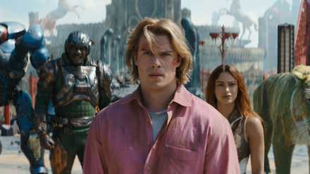 Man at Arms (Idris Elba), He-Man (Nicholas Galitzine), and Teela (Camila Mendes) in Masters of the Universe