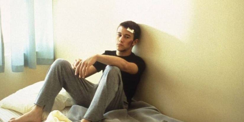 Joseph Gordon-Levitt sitting on a bed in Manic 2001