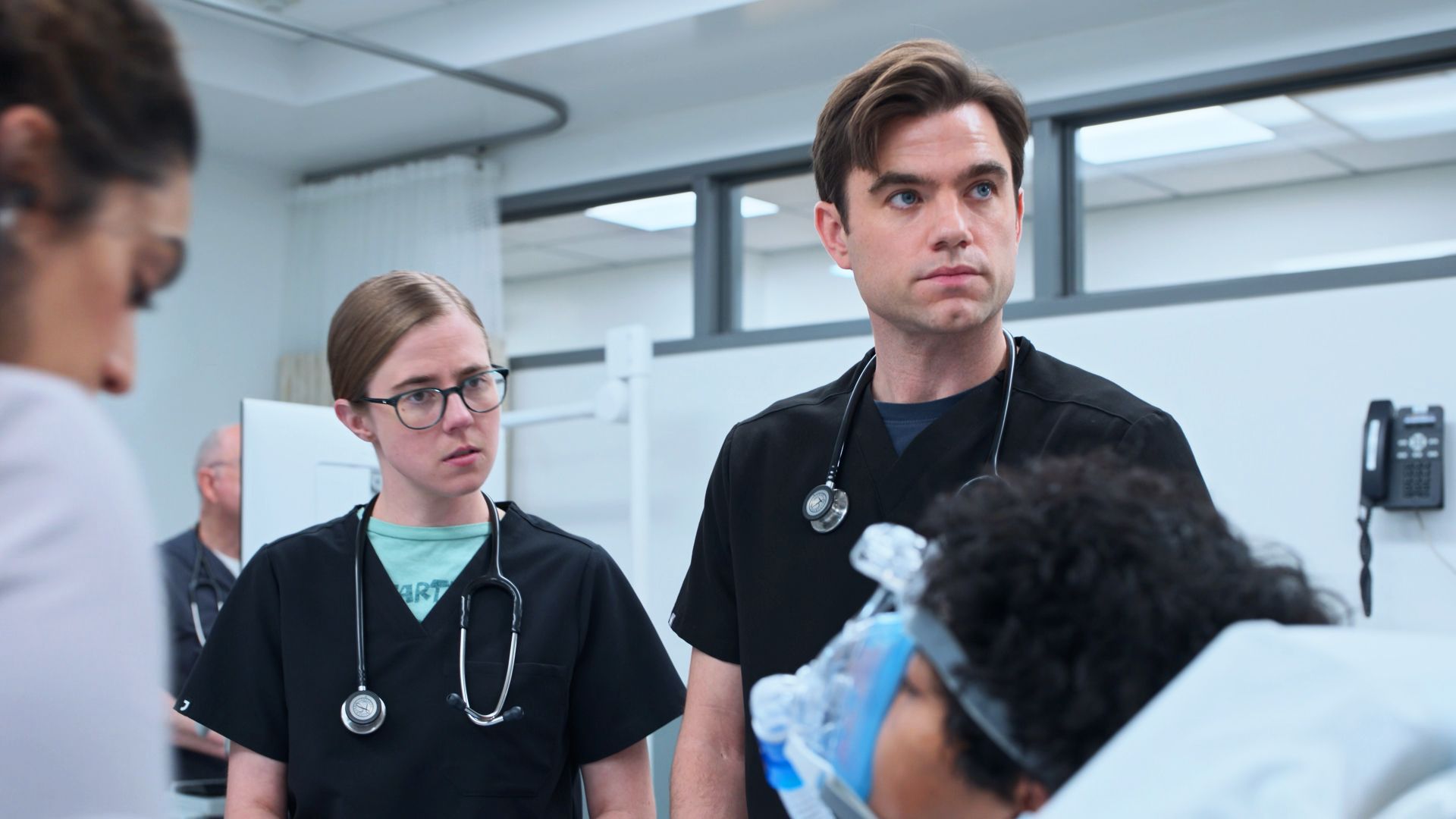 Mel and Langdon talking to a patient in The Pitt season 2, episode 13
