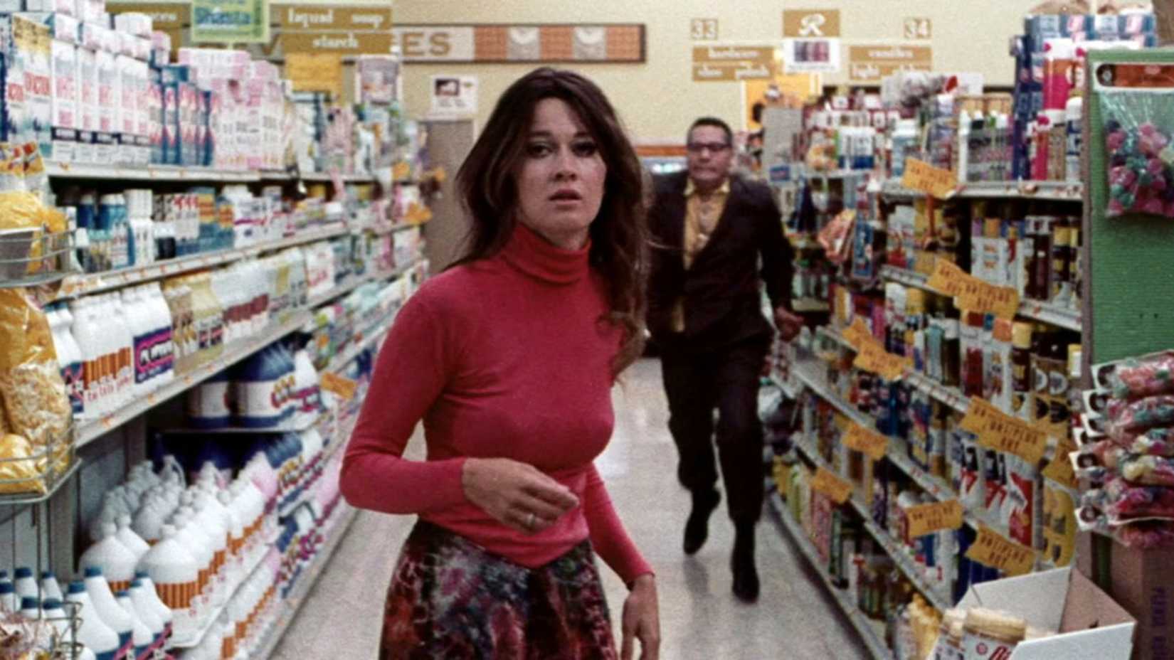 A woman is chased in a supermarket in Messiah of Evil