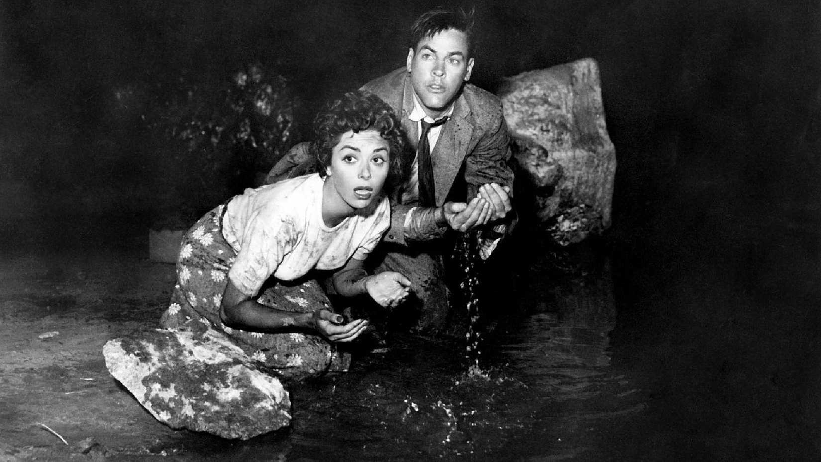 Miles and Becky Drinking Water in a Tunnel While Hiding from the Body Snatchers in Invasion of the Body Snatchers (1956)