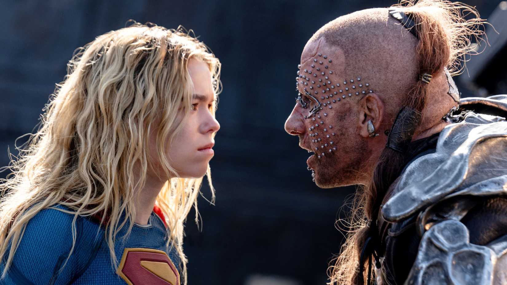 Milly Alcock staring down Matthias Schoenaerts as Krem in Supergirl 2026