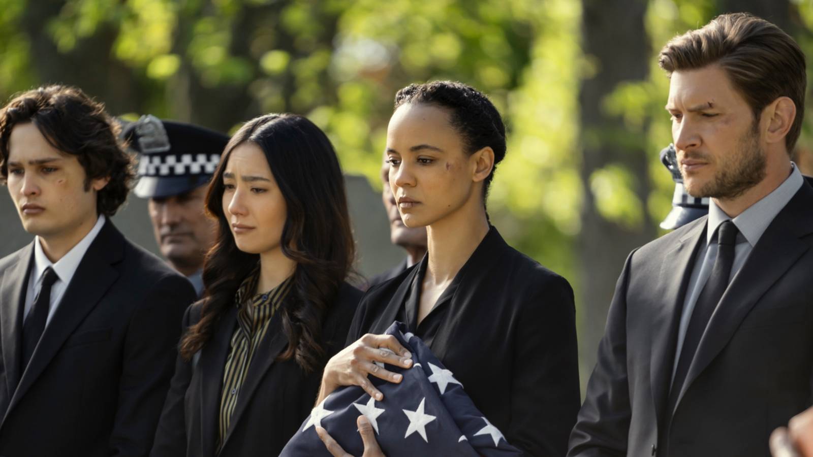 Jasper, Adeline, Neagley, and Holt attending a funeral in Prime Video's Neagley