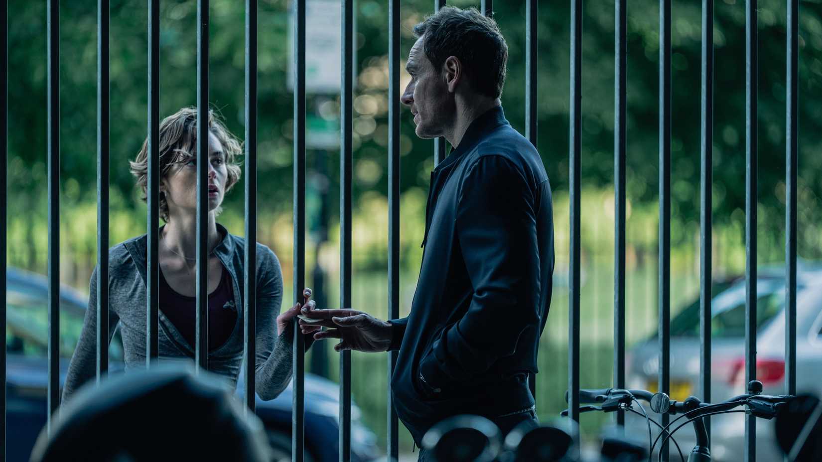 Martian and Danny talking through a fence in The Agency season 2
