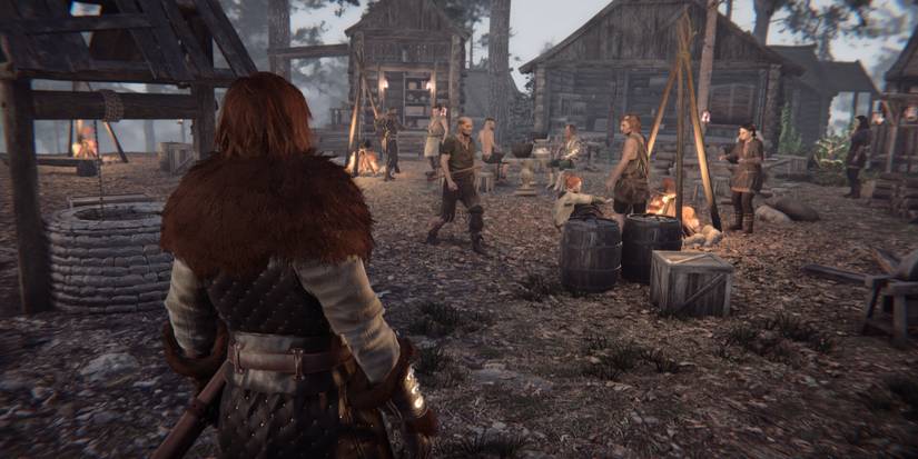 Nested Lands village with people sitting around a fire
