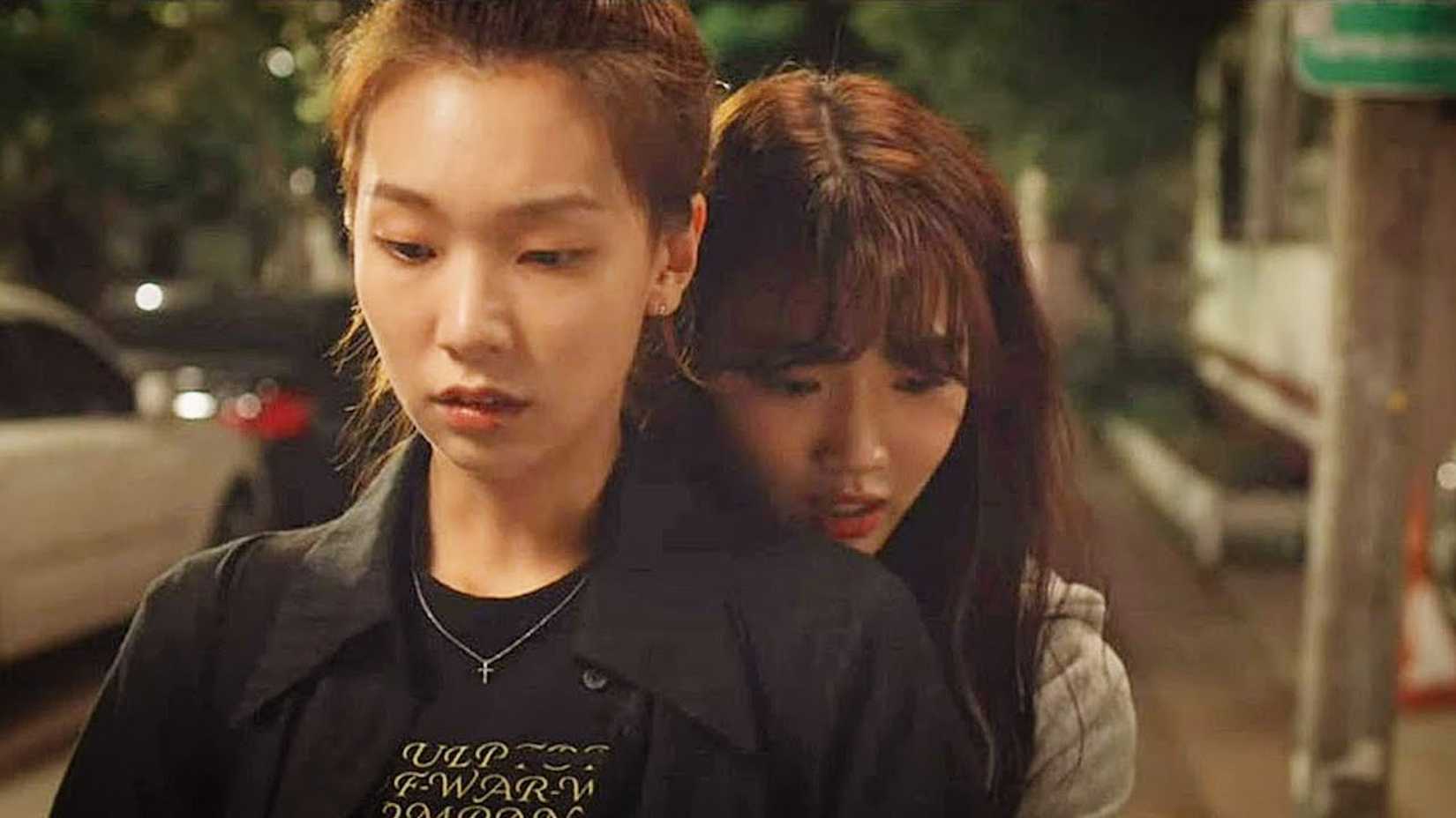 A woman hugs her girlfriend from behind in the K-drama Nevertheless.