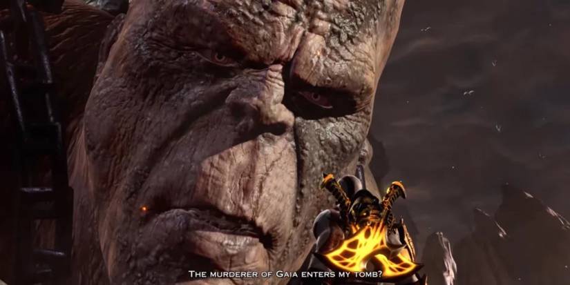 Cronos looks down at Kratos in God of War 3