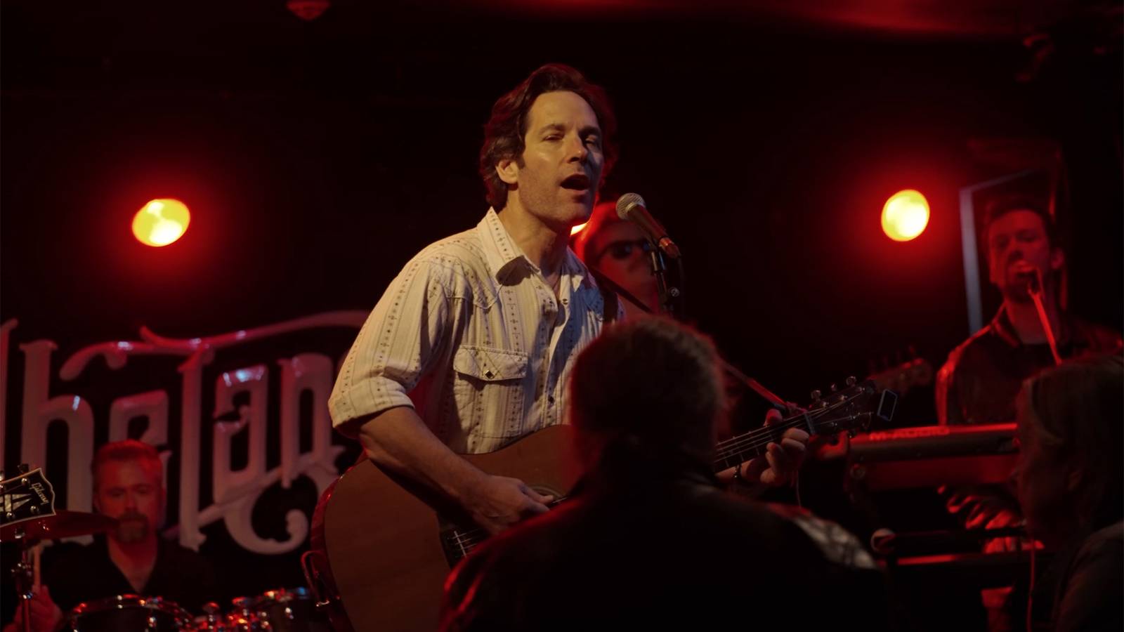 How Paul Rudd & Nick Jonas' Worlds Collide Explained By Power Ballad Crew