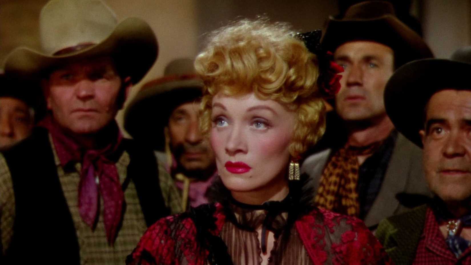 Marlene Dietrich looks on in Rancho Notorious