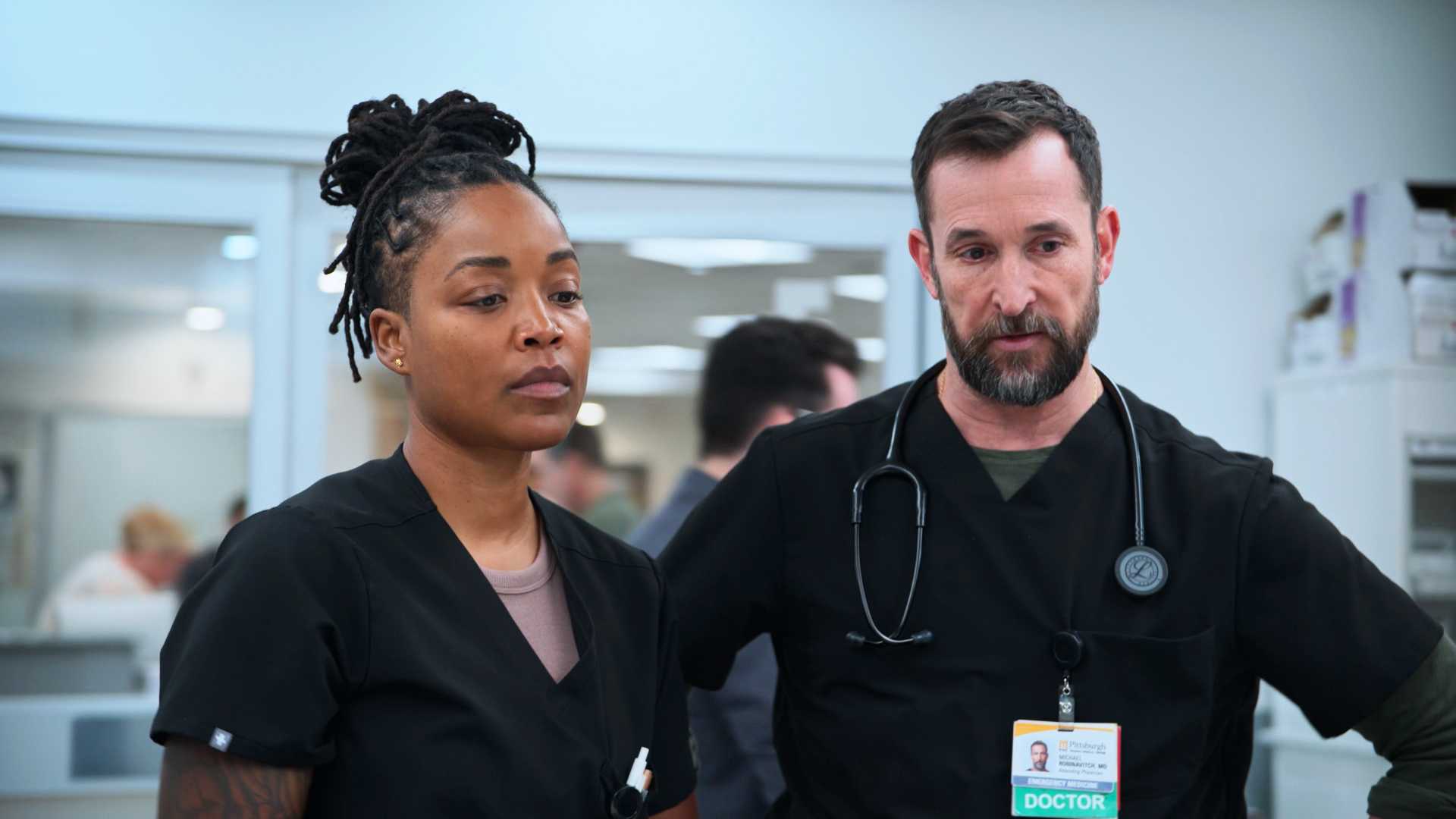Robby and Ellis discussing a patient in The Pitt season 2, episode 13