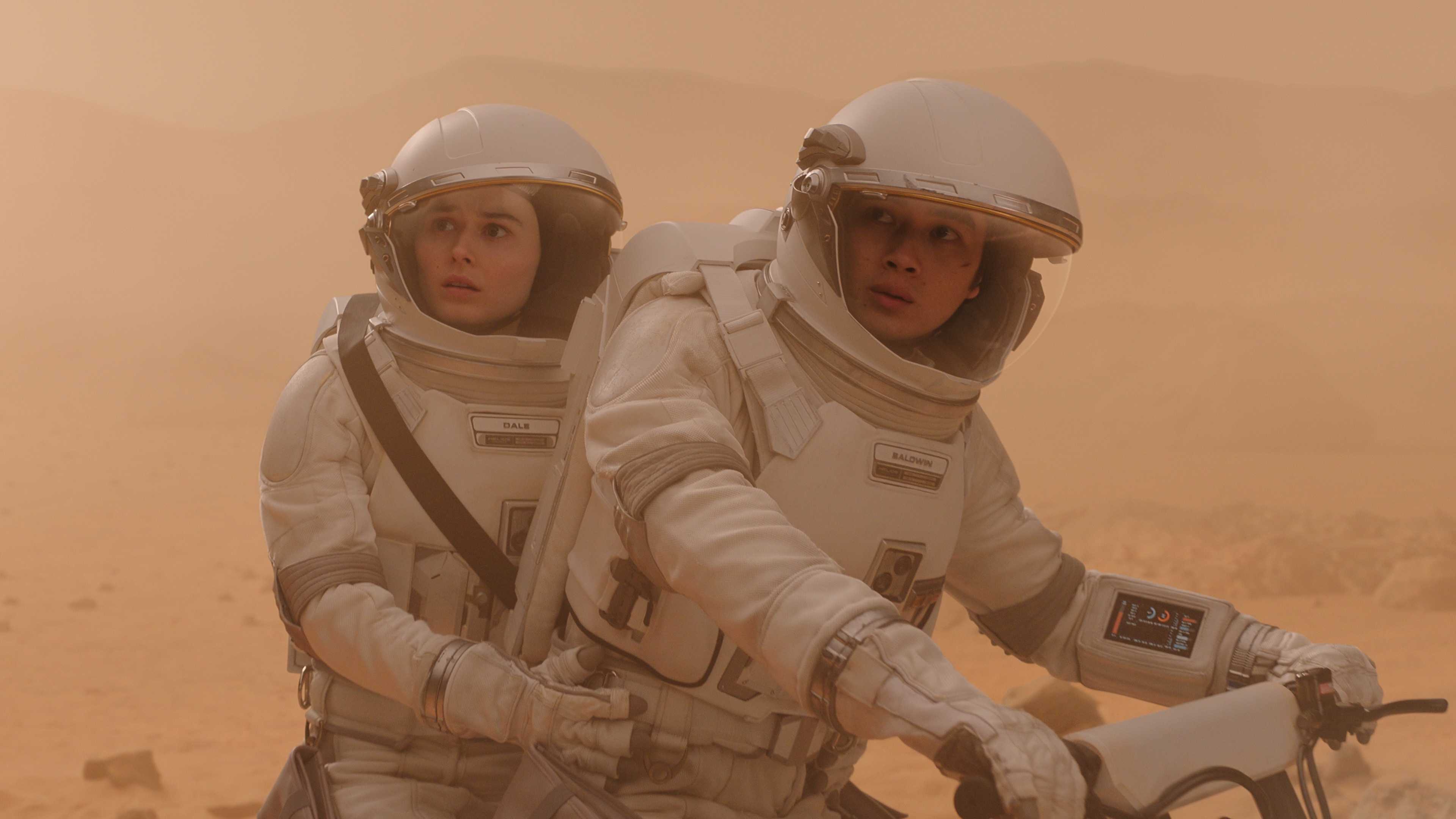 Lily (Ruby Cruz) and Marcus (Barrett Carnahan) riding a lunar vehicle in season 5 of For All Mankind