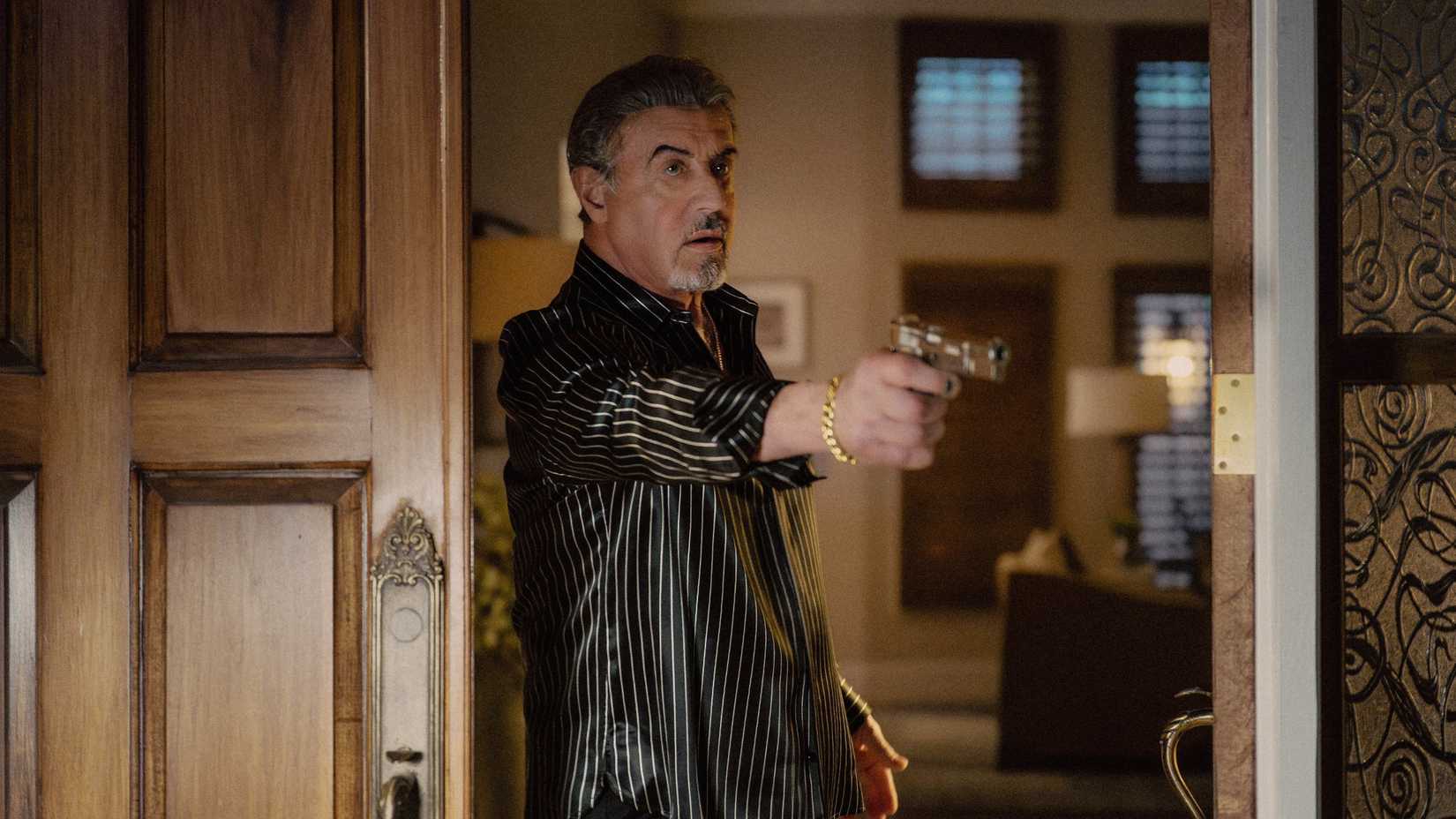 Sylvester Stallone points a gun in a scene from Tulsa King season 3
