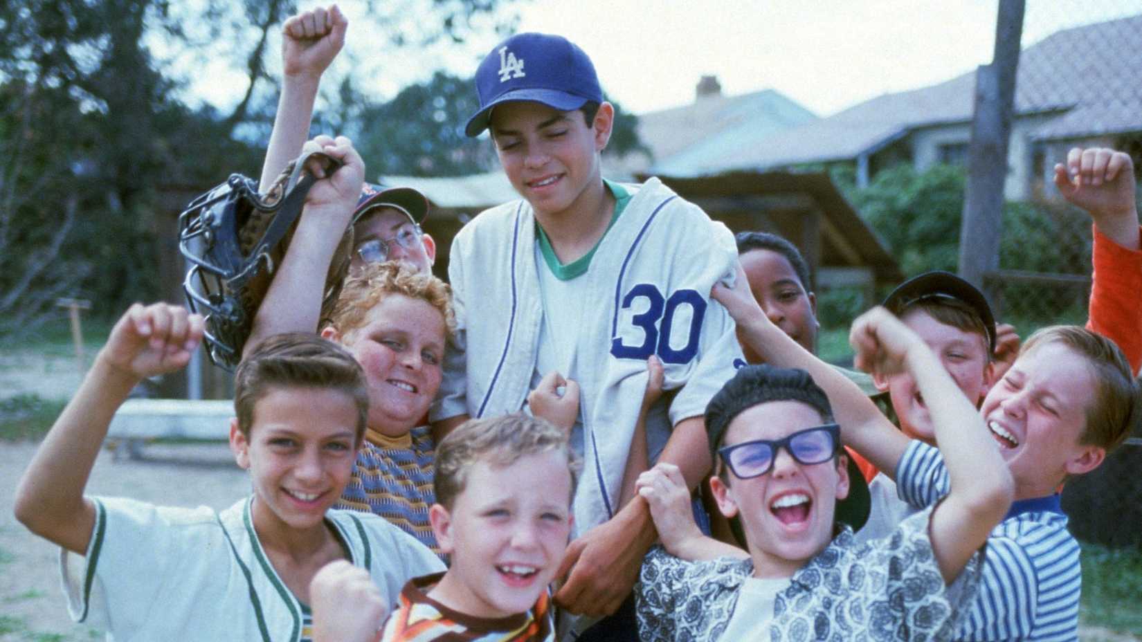 The kids gathered together and cheering in The Sandlot