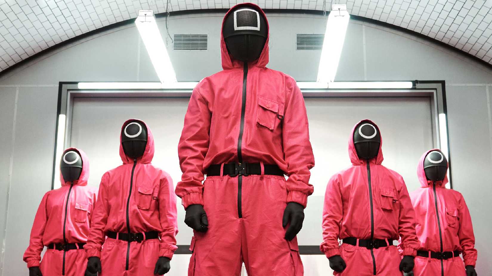 The masked workers in Squid Game.