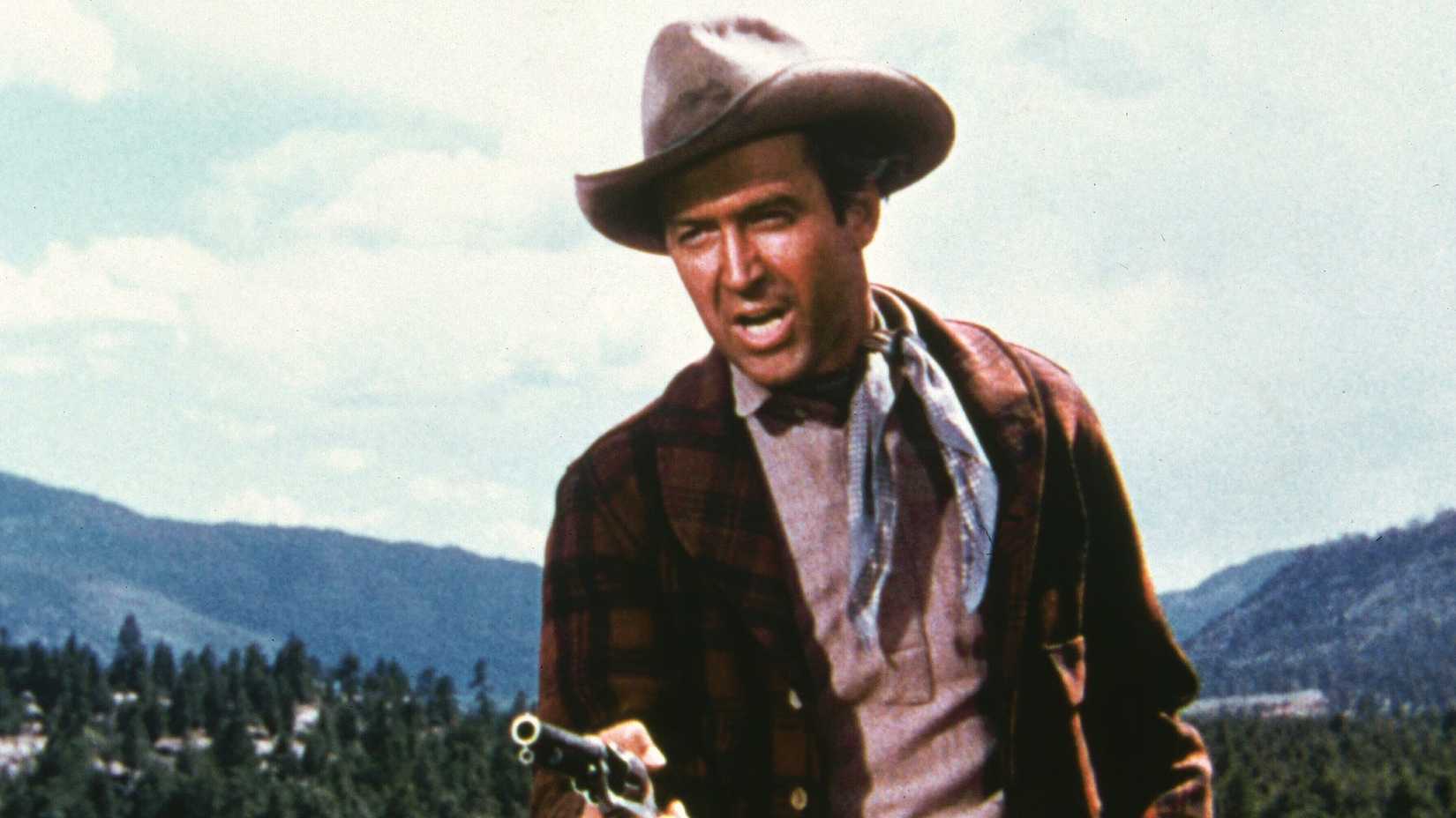 James Stewart points a pistol in The Naked Spur