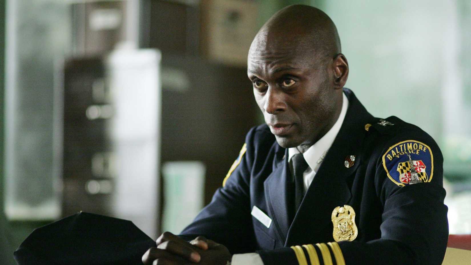 Lance Reddick as Cedric Daniels looking concerned in his police uniform in The Wire.