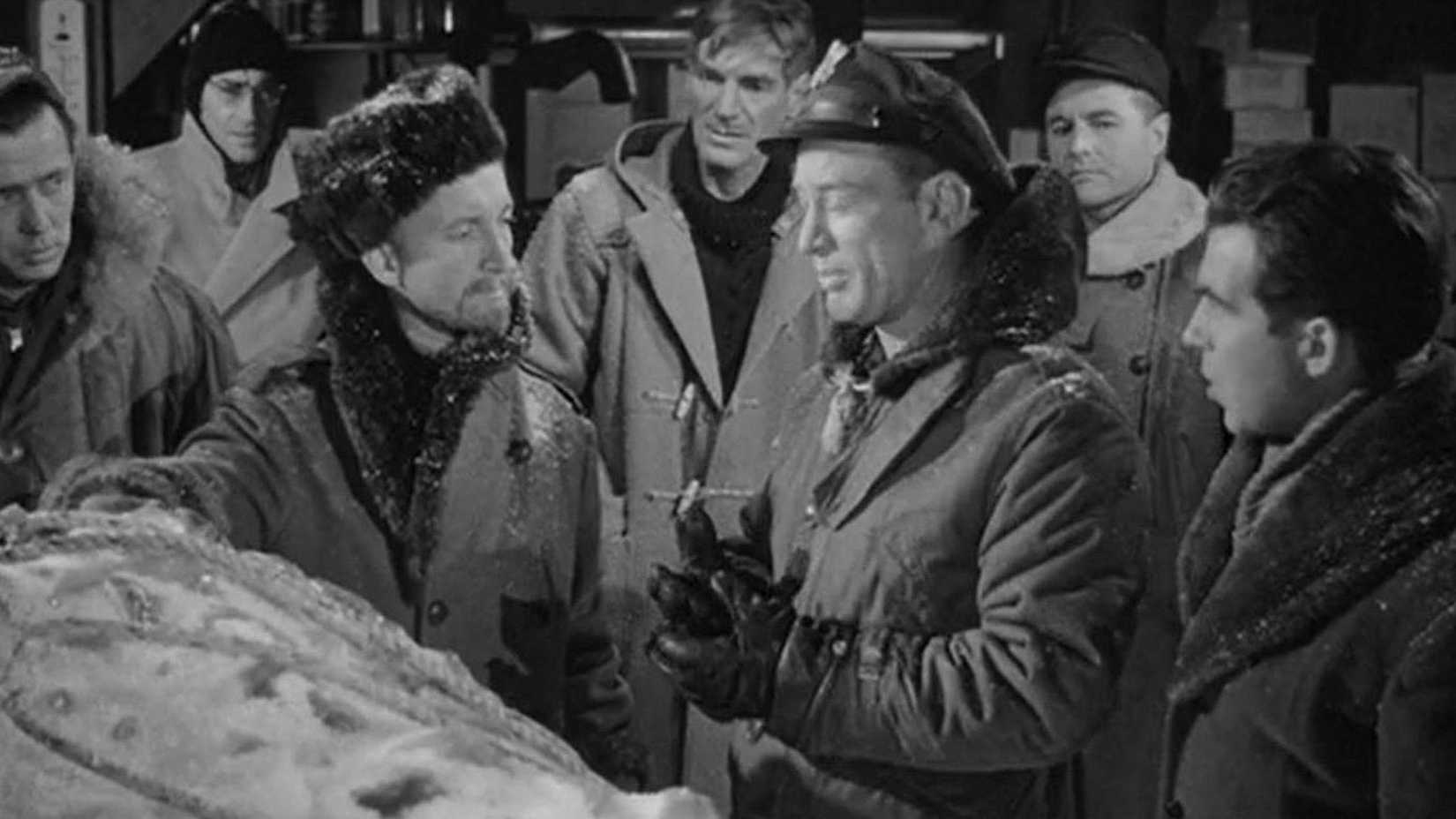 Scientists with the alien in a block of ice in The Thing from Another World