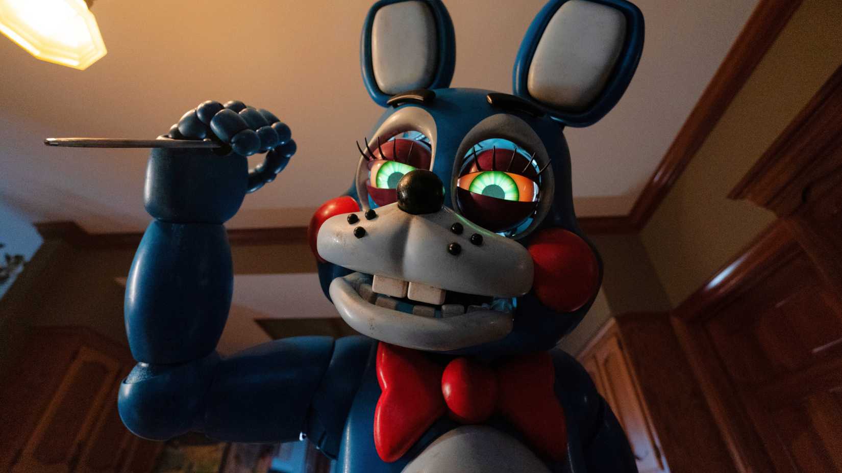 Toy Bonnie holding up a weapon in Five Nights at Freddy's 2