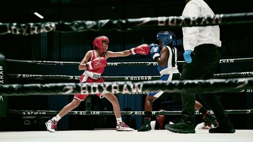 Two kids fighting in a boxing ring in They Fight