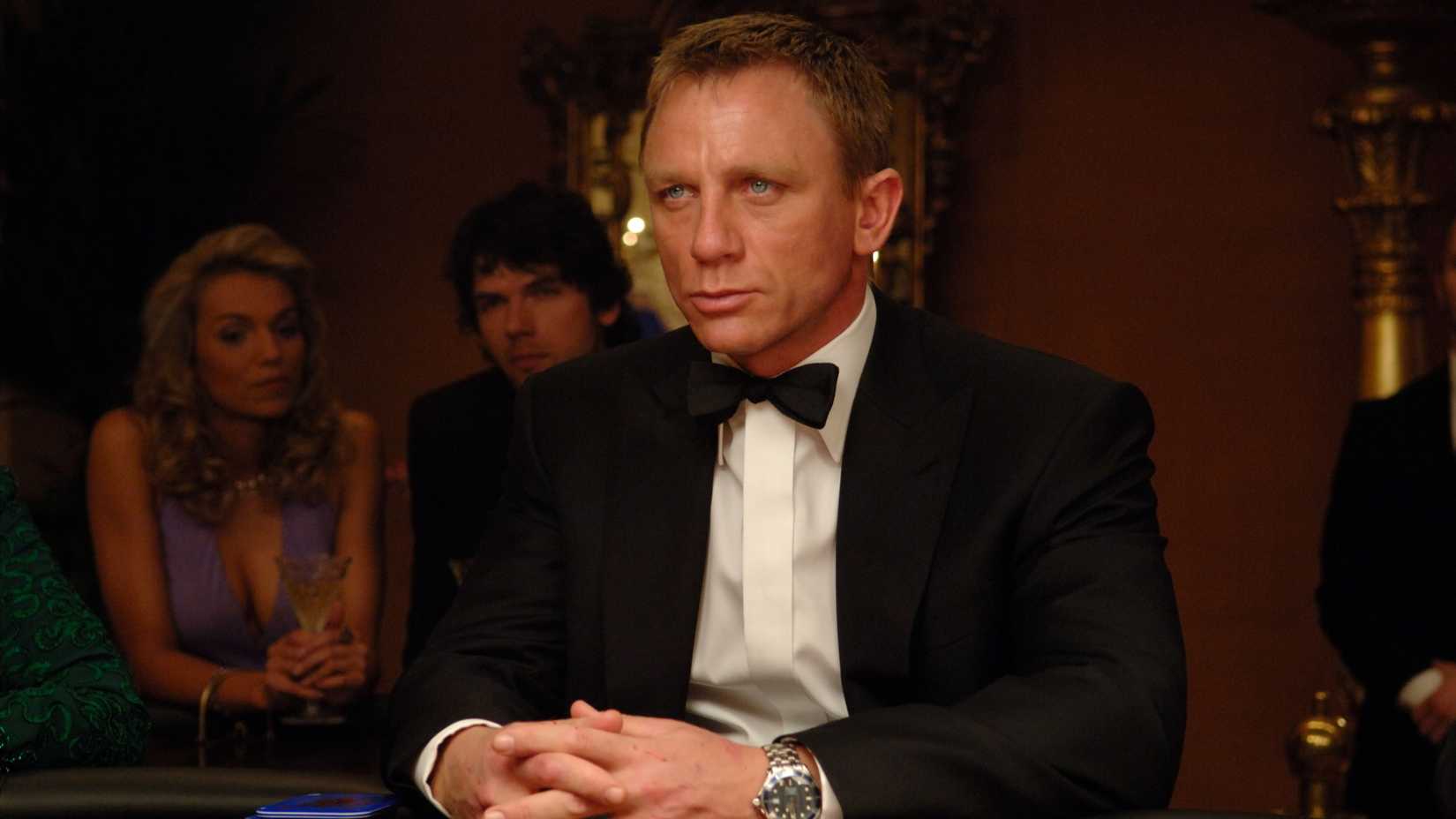 Daniel Craig as James Bond, sitting at a poker table in Casino Royale