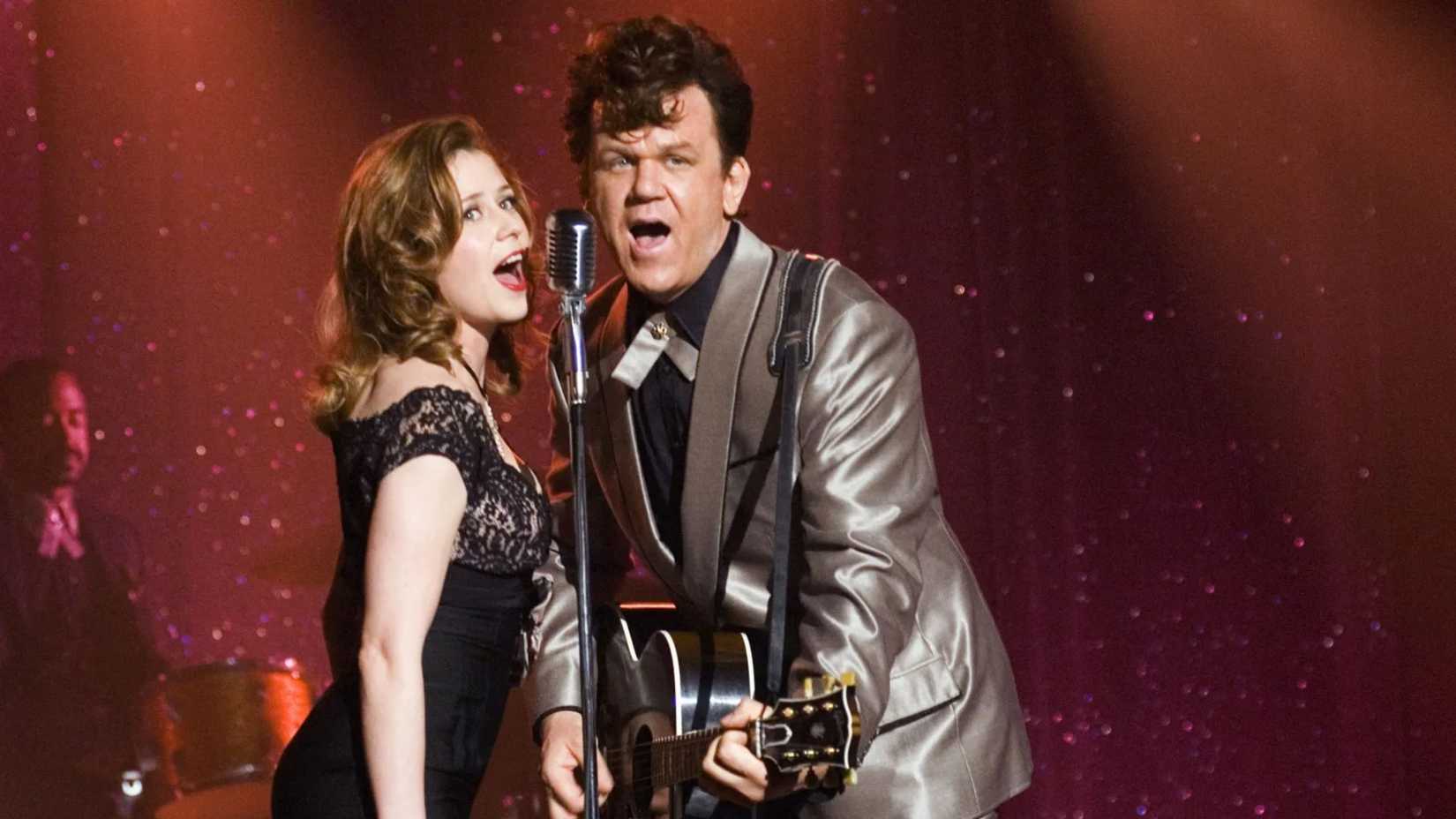 Dewey and his wife sing onstage in Walk Hard