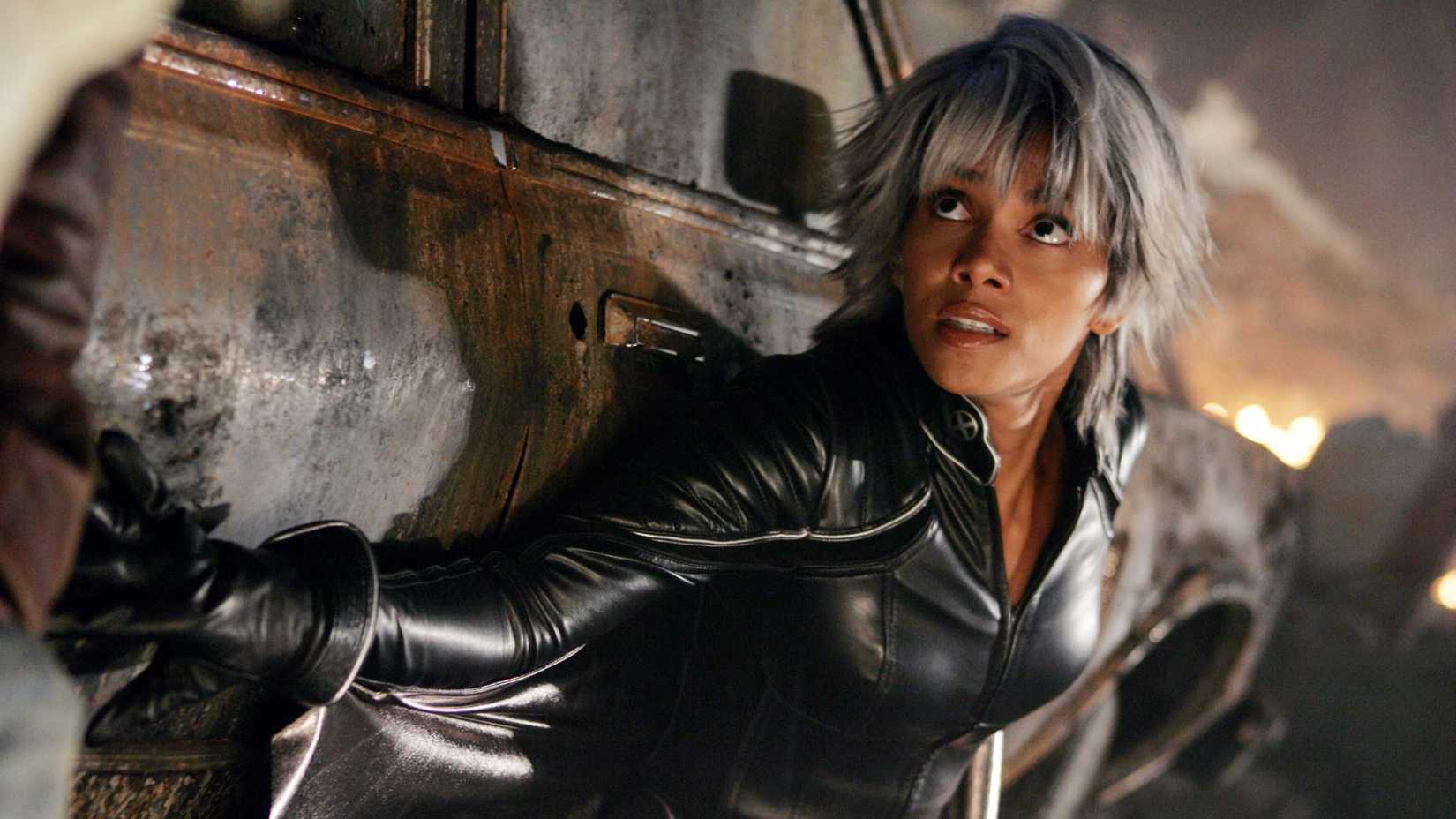 Halle Berry as Storm cowering behind a burnt-out car in X-Men: The Last Stand