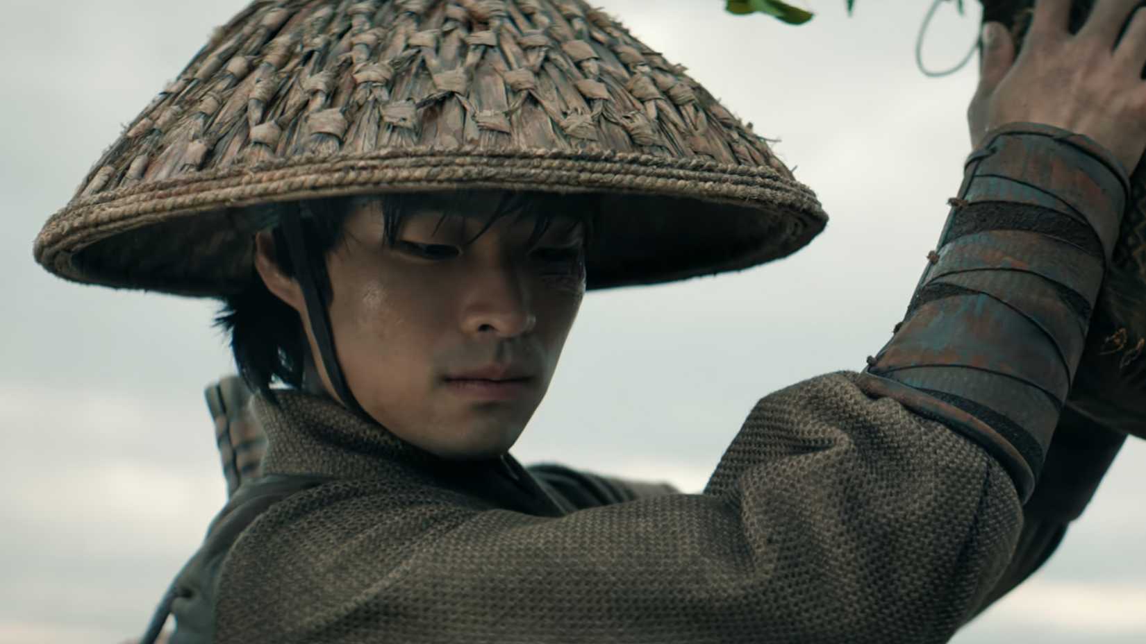 Zuko looking down at a pregnant woman in Netflix's Avatar The Last Airbender