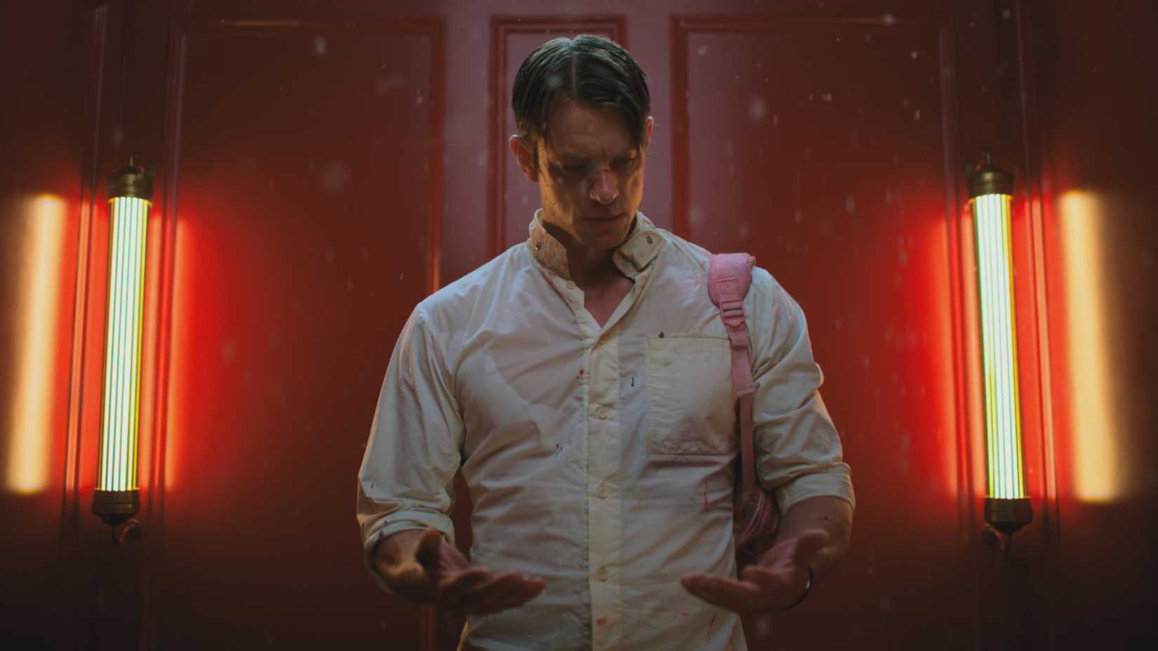 Joel Kinnaman’s Takeshi Kovacs looking at his palms in Netflix’s Altered Carbon season 1