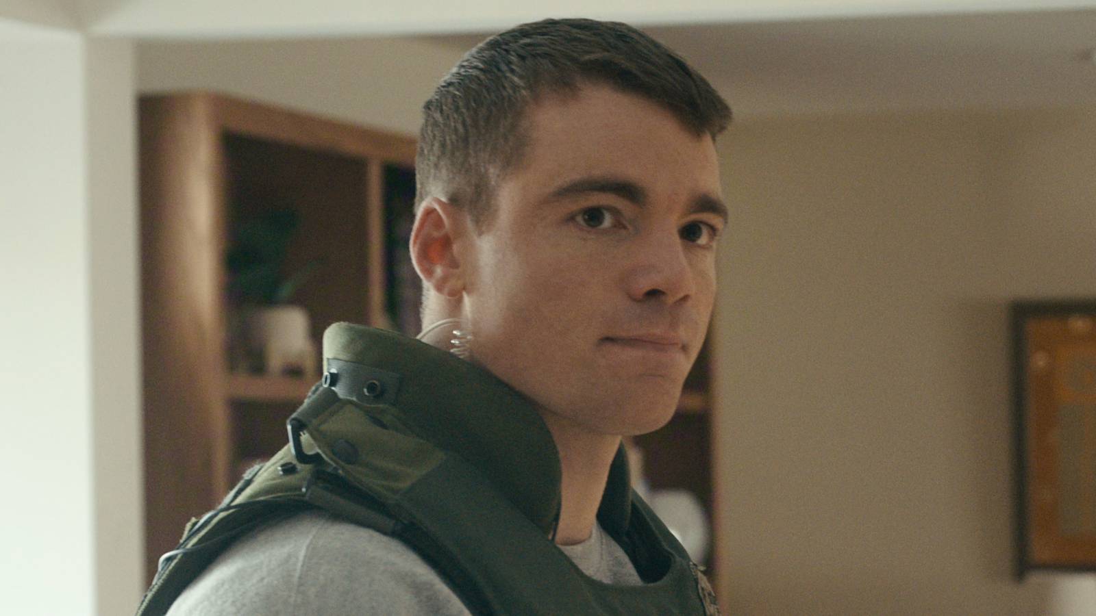 Gabriel Basso’s Peter Sutherland looking sideways in Netflix’s The Night Agent