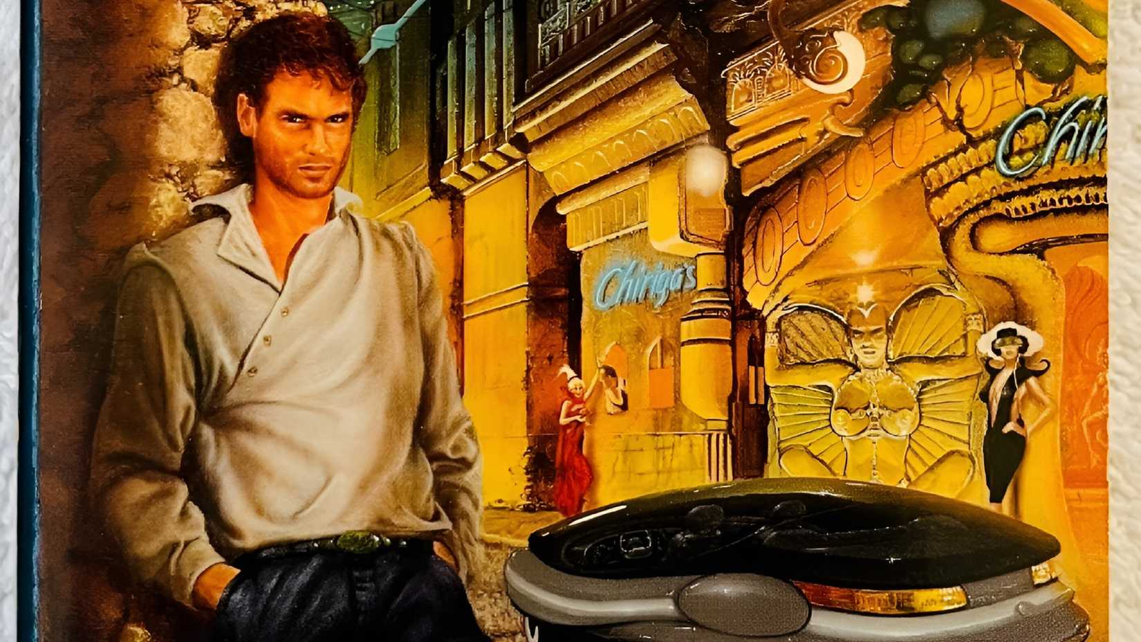 A man standing in a street in the book cover of George Alec Effinger’s When Gravity Fails