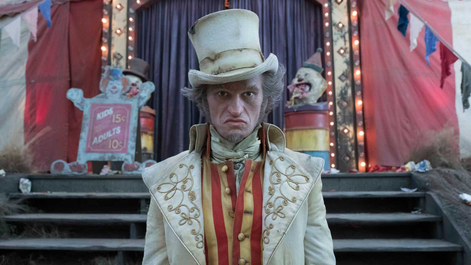Count Olaf (Neil Patrick Harris) standing in front of circus tent in A Series of Unfortunate Events.
