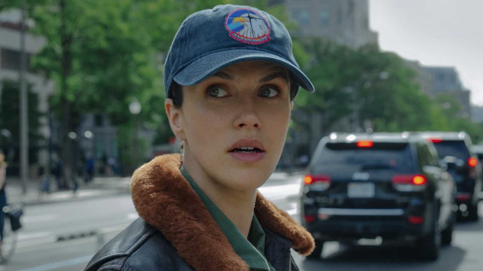Jessica Brown Findlay’s Charlotte crossing a road in Silo season 3
