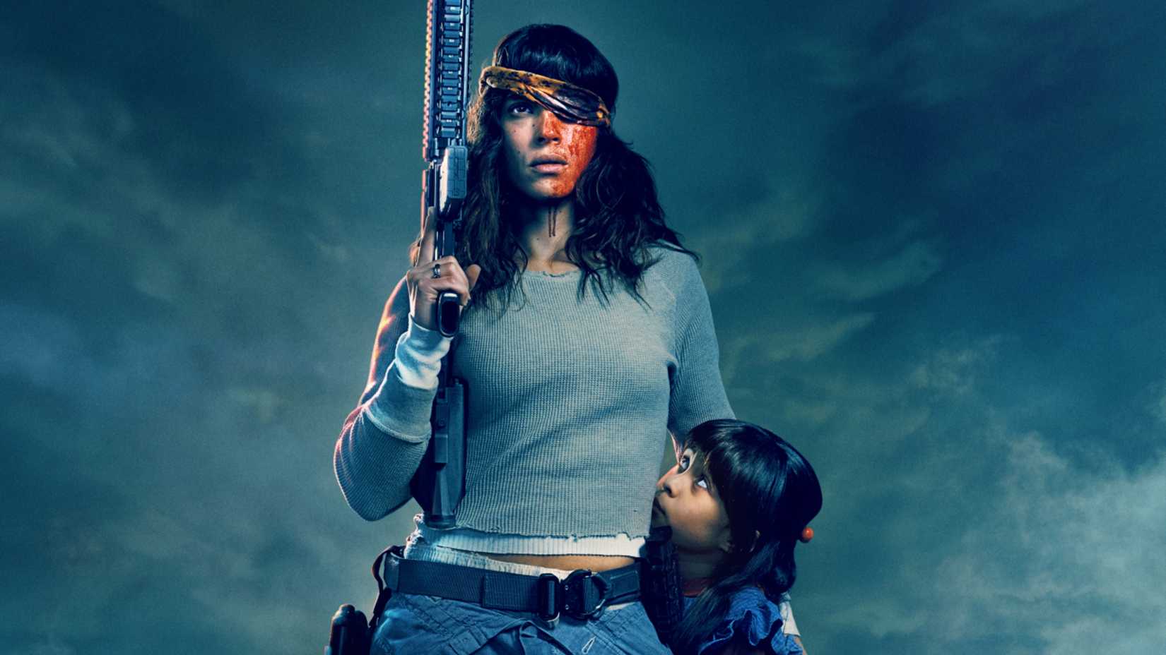 Adria Arjona as Celeste wearing an eyepatch holding a gun and protecting a child in Onslaught
