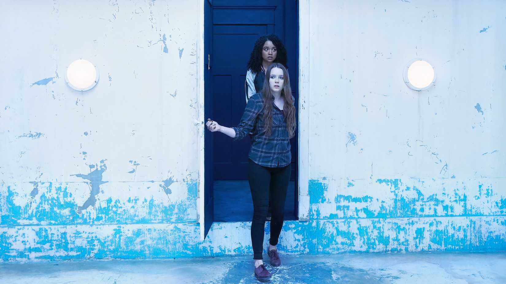 Amy Forsyth and Aisha Dee enter a strange room in Channel Zero season 2