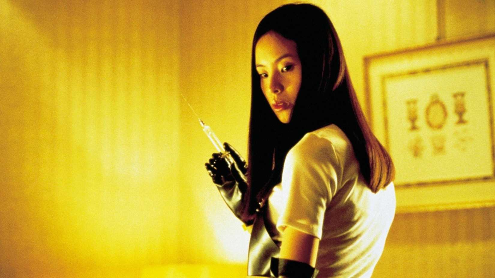 A woman holds a syringe in Audition