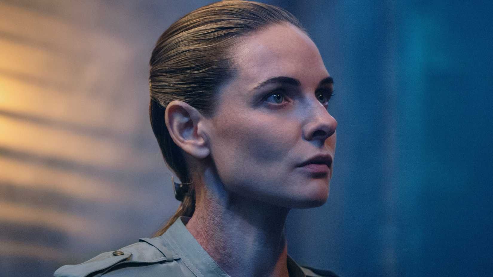 Rebecca Ferguson’s Juliette carefully listening to a guard in Silo season 3
