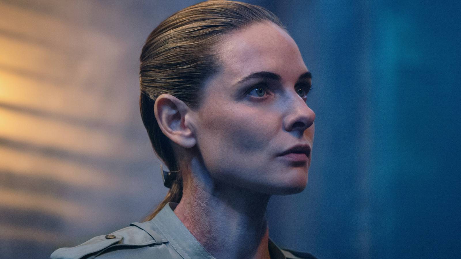 Rebecca Ferguson’s Juliette carefully listening to a guard in Silo season 3