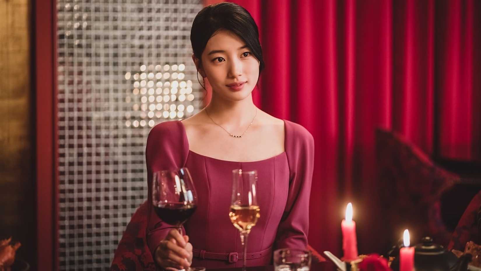 Bae Suzy holding a wine glass in the 2022 K-drama Anna.