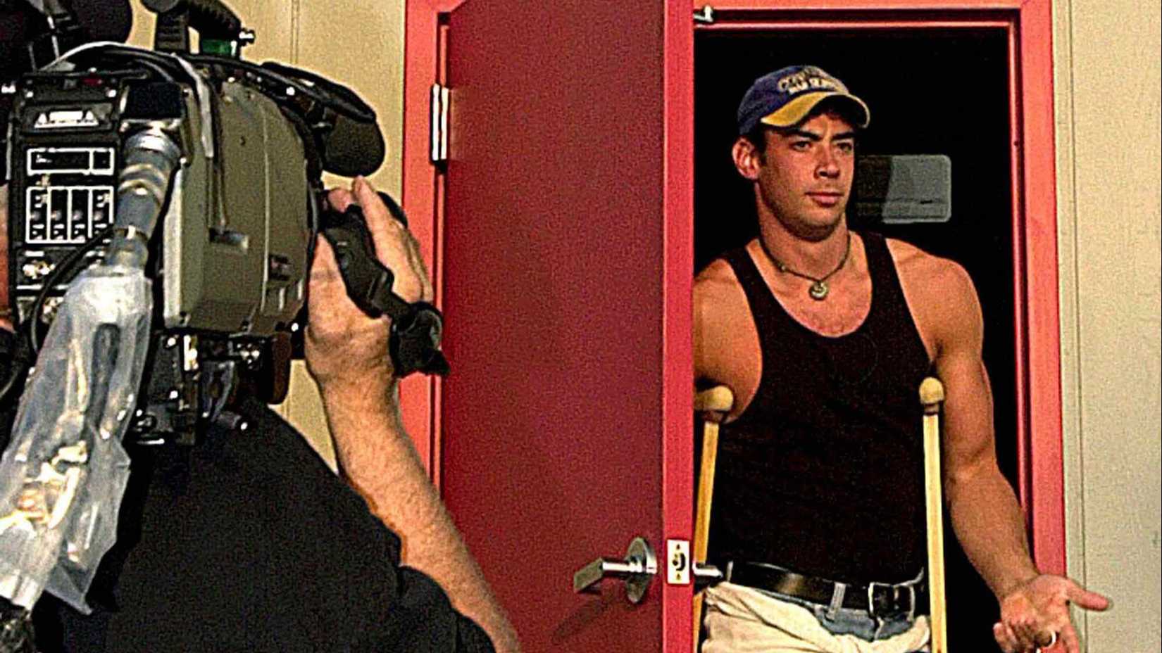Big Brother season 1 winner Eddie McGee walking out of the house.
