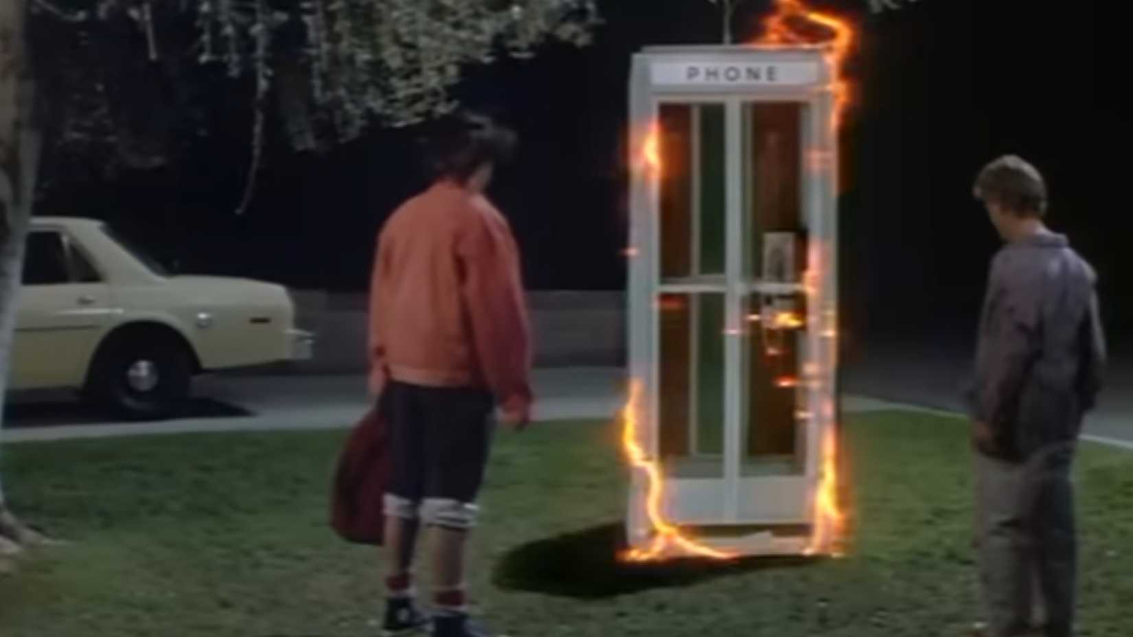 Bill and Ted standing around a time travelling phone booth in Bill and Teds Excellent Adventure